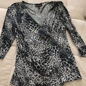 Dana Buchman pull over shirt. Good condition. Size large.